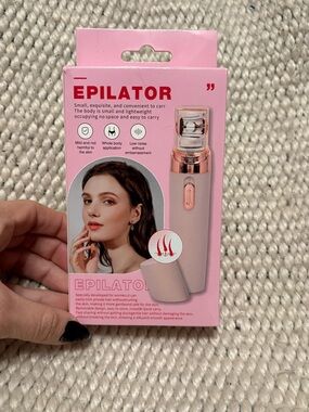 Brand new pink epilator. Only taken out of box for pics. Gets great reviews!